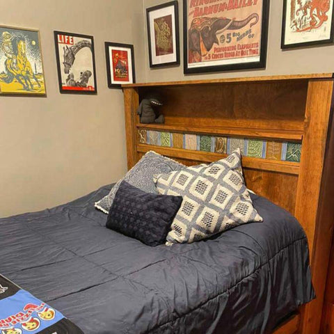 handcrafted wooden bed featuring multicolored handmade tiles in the headboard