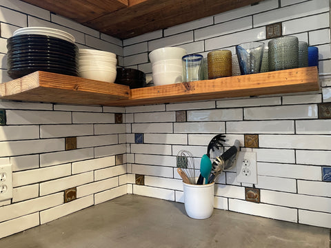 kitchen backsplash featuring handmade tiles mixed with subway tiles