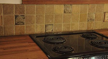 Kitchen installation of handmade ceramic tile art