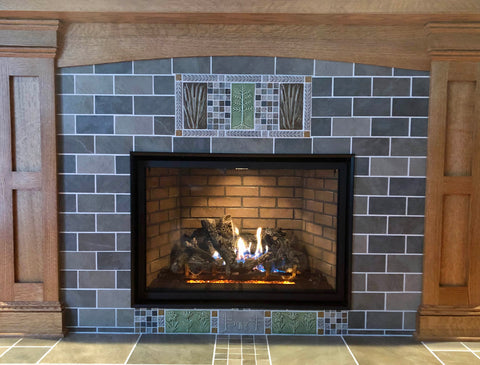 handmade tiles installed in a fireplace surround