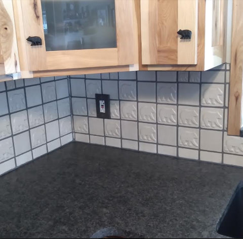 handmade bear tiles installed in a kitchen