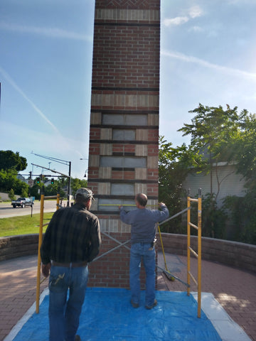 masons building a chimney swift tower in downtown kent ohio