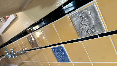 a 1939 vintage tile kitchen which has been slightly modified to include handmade arts and crafts style tiles