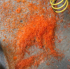 My shop floor with orange Alumilite shavings everywhere - Dailey Woodworking