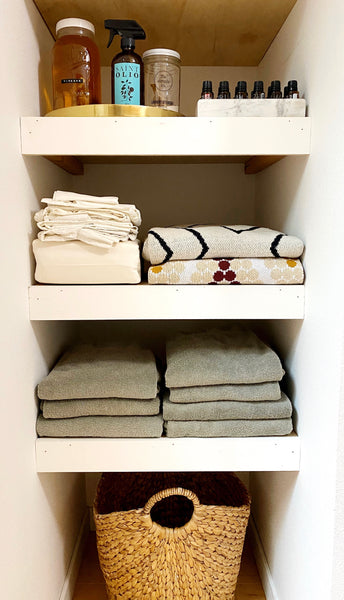 Linen Closet Organization with Baskets: A simple way to eliminate