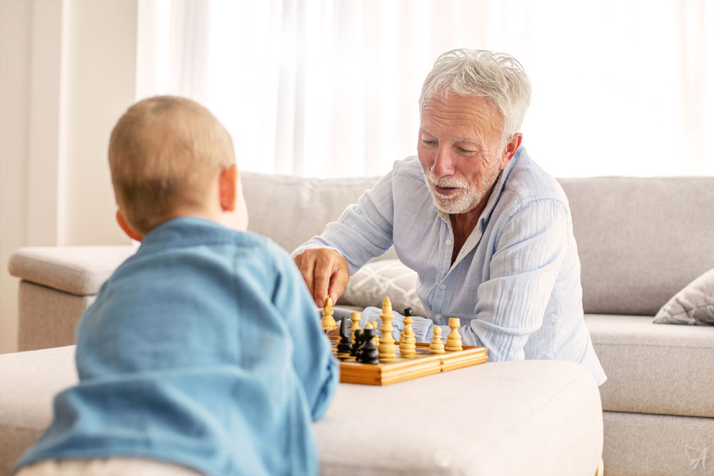 Man and grandson playing chess