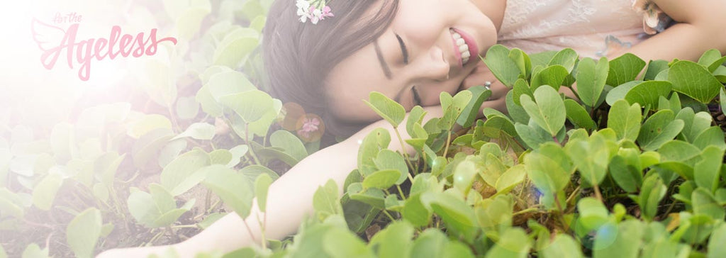 Ageless girl surrounded by plants banner