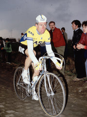 Sean Kelly floating over the cobbles in the Spring Classics in the iconic KAS jersey