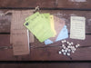 A photograph of the bag, booklet, cards and tokens for the Quiet Year