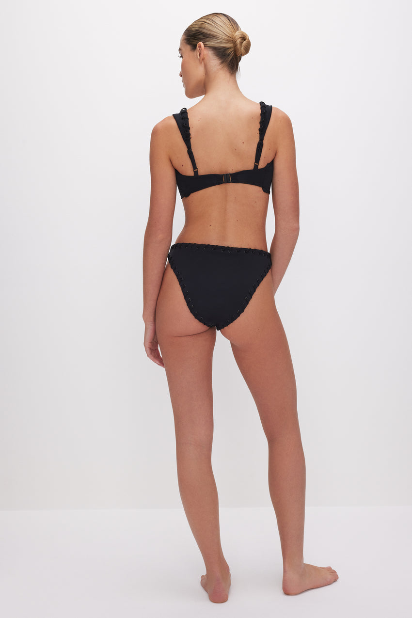 WHIP STITCH COMPRESSION CHEEKY BIKINI BOTTOM | BLACK001 View 4 - model: Size 0 |