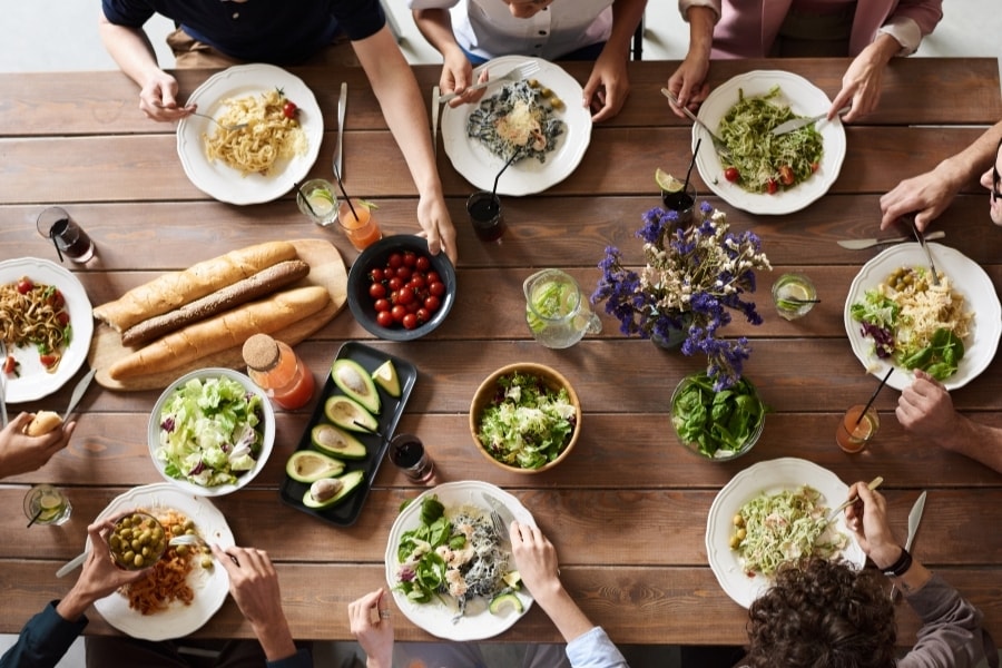 different dishes on long wooden table