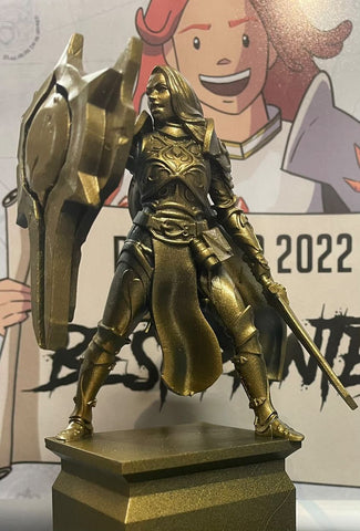Gold trophy in the shape of a female knight in armour
