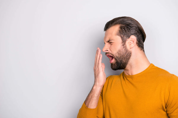 drinking soda can make you feel awful - man yawning