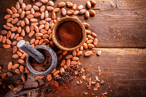 cacao nibs and cacao powder on wooden background