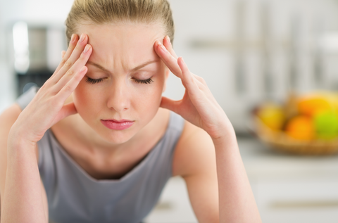 stressed young housewife in modern kitchen