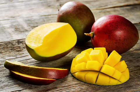 sliced mango on wooden counter