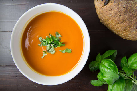 white bowl of tomato soup