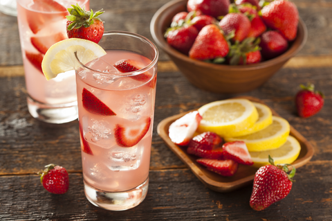 Refreshing Ice Cold Strawberry Lemonade on a background