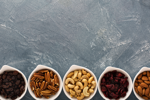 small bowls of nuts and dried fruits