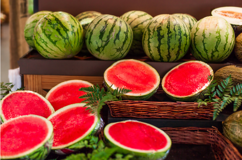 cut watermelons on wooden counter