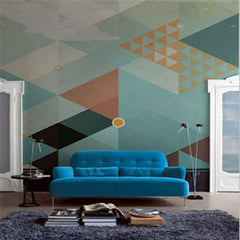 geometrical wall and blue sofa