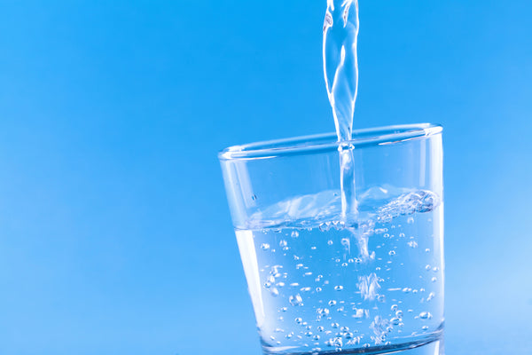 Water Pouring Into A Glass