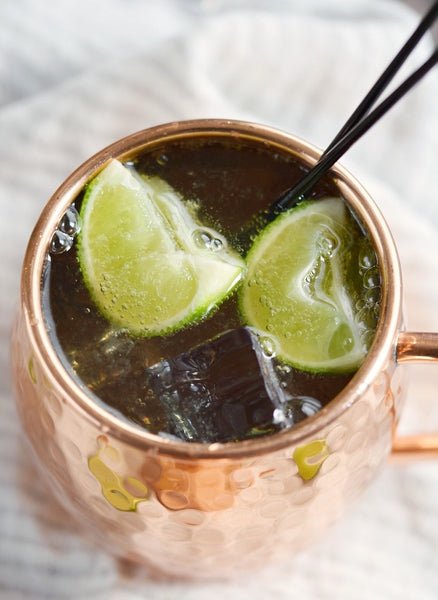 Moscow Muled copper mug containing liquid ice and lime slice top view