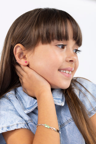 Girl wearing enamel ball earrings