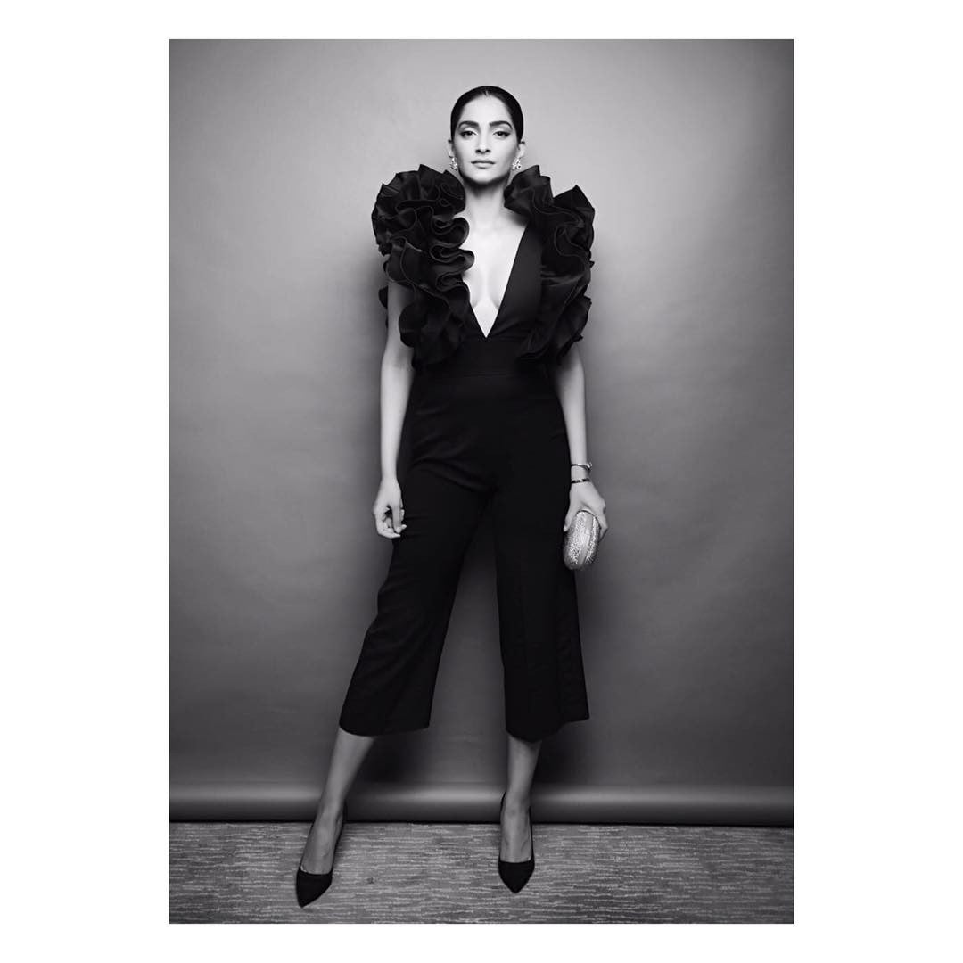 Sonam Kapoor in black cropped jumpsuit with ruffled detailing around the neckline Designer western wear from Rosario Atelier Collection