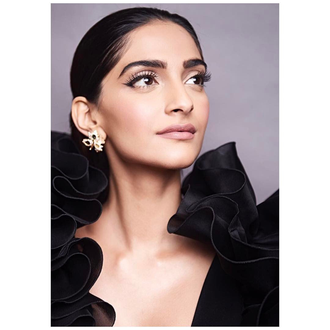 Sonam Kapoor in black cropped jumpsuit with ruffled detailing around the neckline Designer western wear from Rosario Atelier Collection