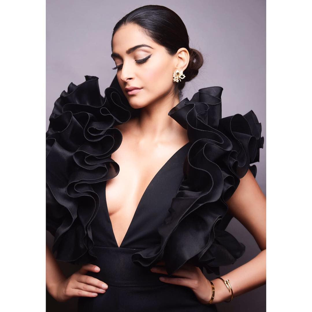 Sonam Kapoor in black cropped jumpsuit with ruffled detailing around the neckline Designer western wear from Rosario Atelier Collection