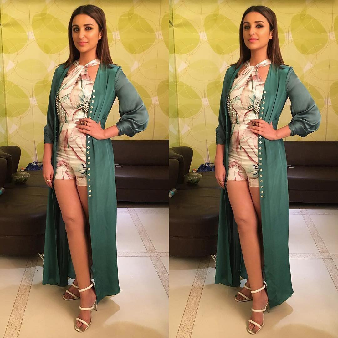 Parineeti Chopra looks AMAZING! 🌸She's wearing Lola by Suman B Pearl Embroidered Floral Bodice Playsuit paired with Lola by Suman B Moss Green Cape 