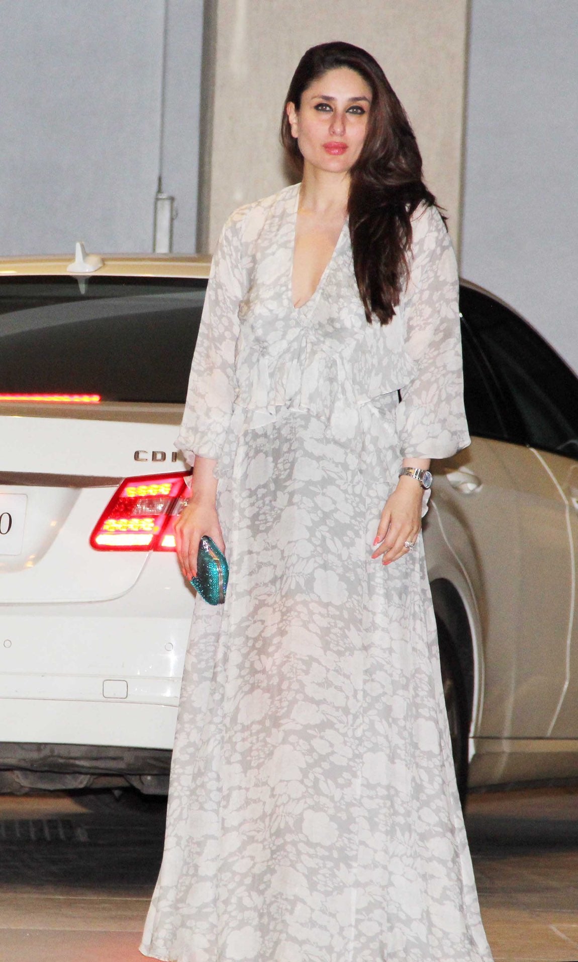 Kareena Kapoor in a printed maxi dress featuring long ruffled sleeves from Deme by Gabriella. 