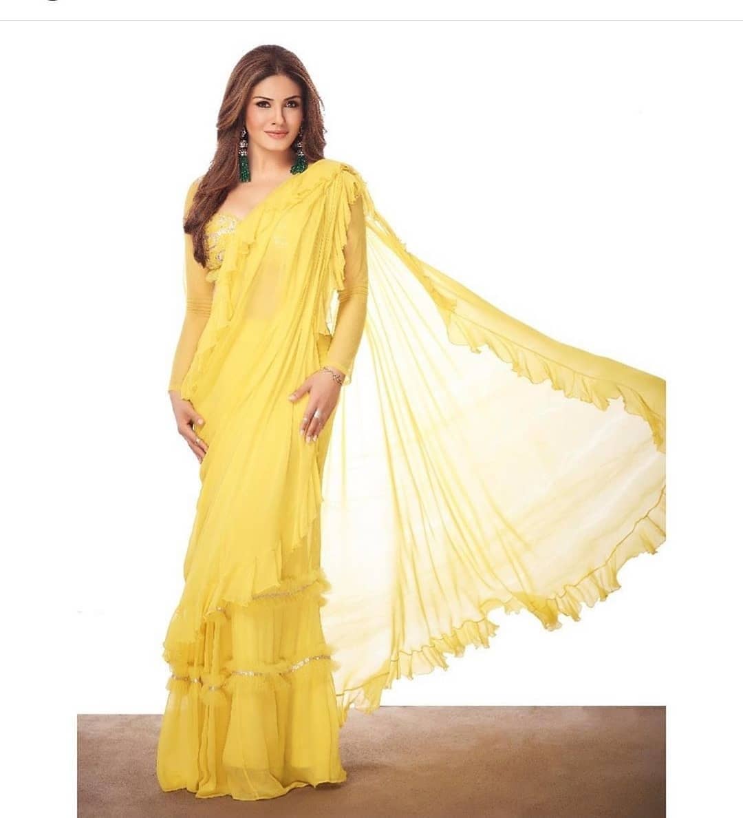 Raveena Tandon in yellow plain ruffle saree