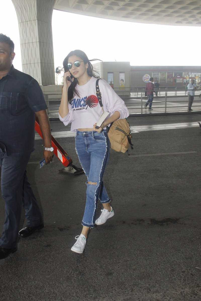 Anushka Sharma completes her Airport look with Christian Dior Bag