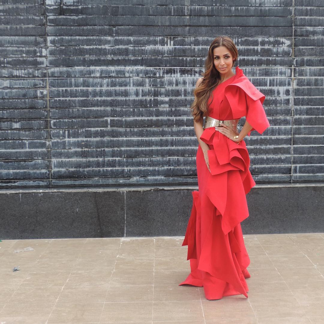 For the shoot of India's next Super model Malaika Arora wore a dramatic ruffled gown by Gaurav Gupta in a firey red hue