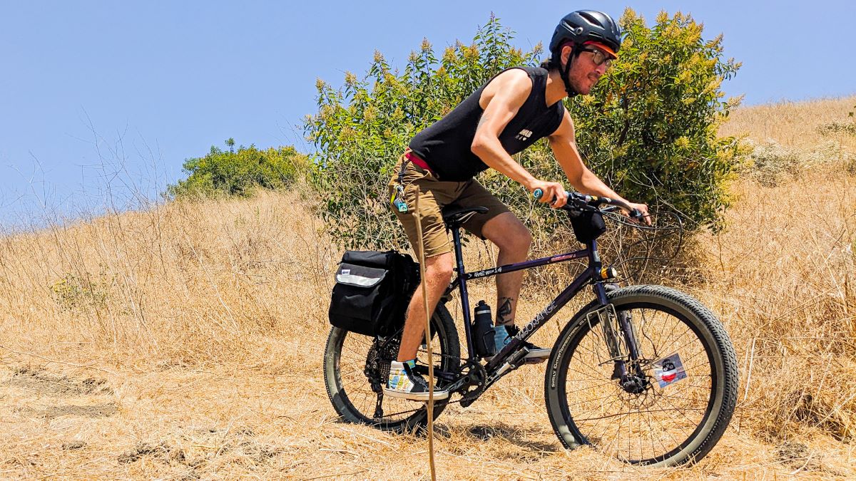 Juan riding with Anywhere Panniers