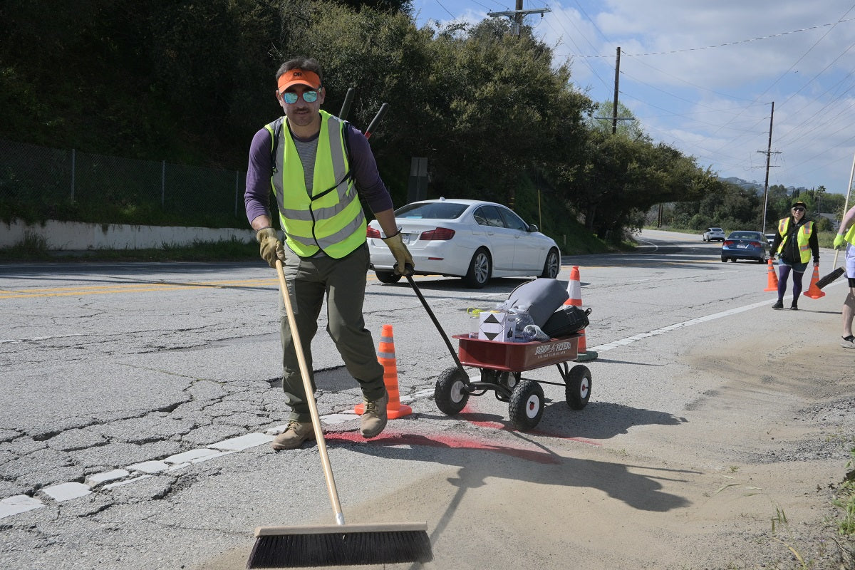 Sam Omar of People Powered Media Sweeping the Street