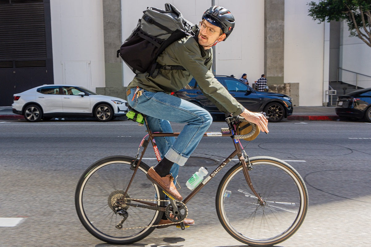 Delivering postage by bike using the Americano Backpack