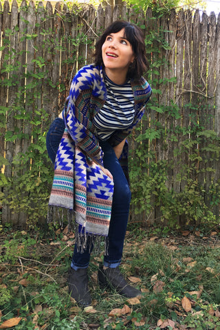 ShopMucho owner models Mexican clothing Southwest style shawl in blue aztec