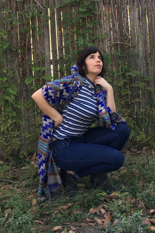 ShopMucho owner models Mexican clothing Southwest style shawl in blue aztec