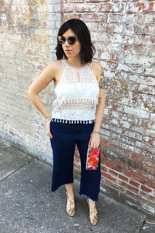 ShopMucho owner style an outfit for a summer evening out downtown in crochet crop top and crop denim frayed denim pants