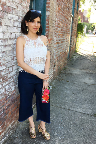 ShopMucho owner style an outfit for a summer evening out downtown in crochet crop top and crop denim frayed denim pants