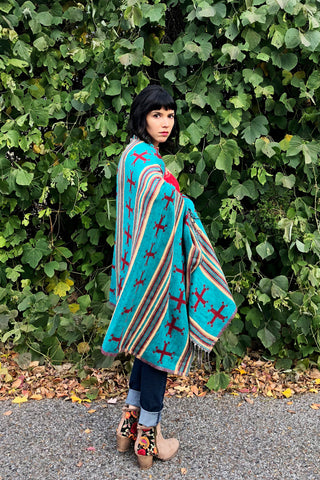 ShopMucho owner styles ways to wear the southwest style shawl with the Mexican blouse and skinny jeans