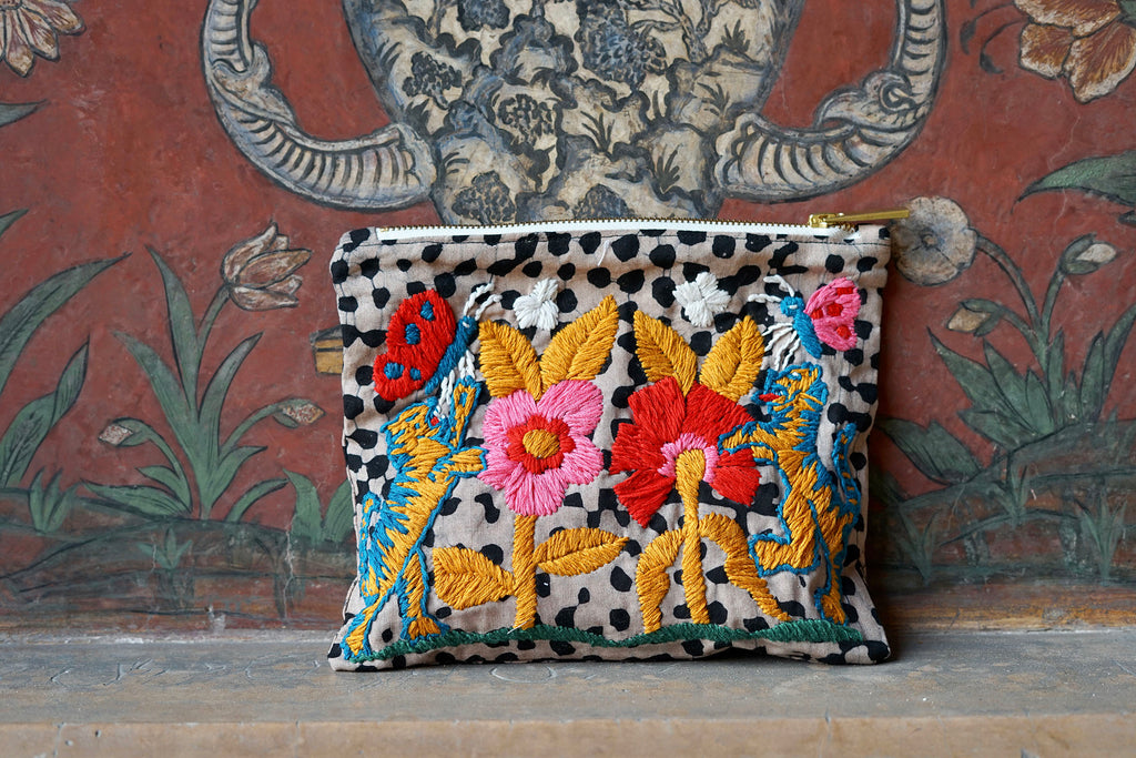 Wenlin Studio embroidered pouch with Osei-Duro fabric, blending traditional craftsmanship and modern style.
