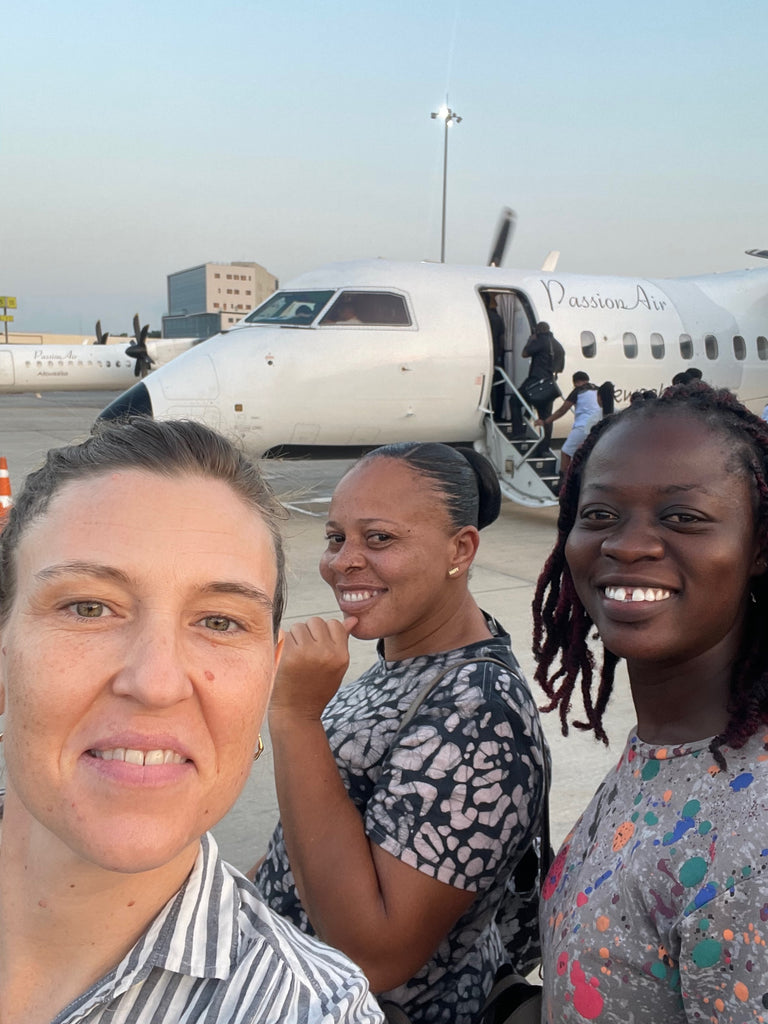 Osei-Duro production team board Passion Air flight, capturing a moment of travel in Ghana’s dawn/dusk light.