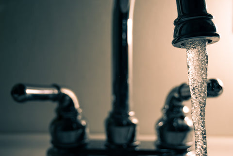 Running water comes out of a faucet.