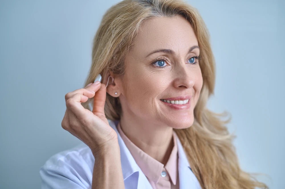 doctor-testing-hearing-aid-his-ear.webp__PID:c3d67c20-b972-48b9-be72-b69a1bab22a8