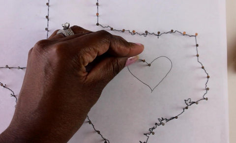 use nails for DIY state heart string art outline