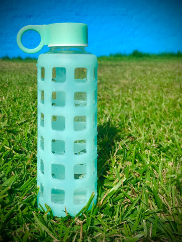 Purifyou glass bottle on grass